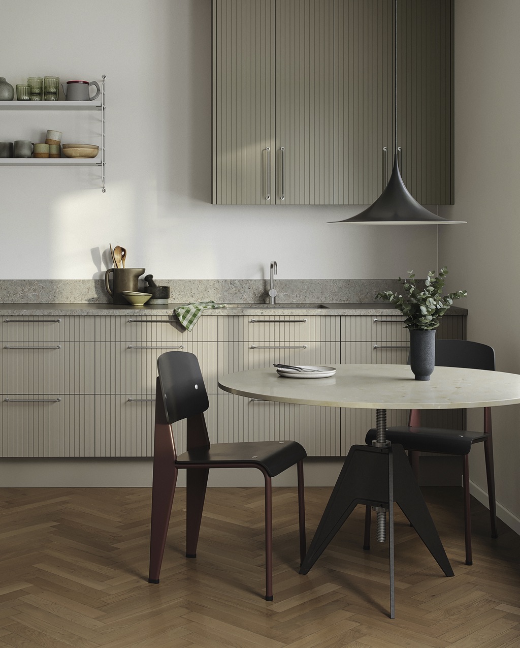 Das Tischbein im groben Industrie-Stil ist absolut außergewöhnlich. Einen tollen Kontrast dazu bildet die helle, minimalistische Steinplatte. Die Küchenmöbel sind von Superfront.
