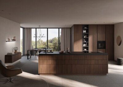 Häcker hat eine edle Rillenfront im Programm. Es gibt sie unter anderem in „Nussbaum elegant“. Der Stil kommt durch die grifflosen Fronten noch mehr zum Ausdruck. Produziert werden sie mit Echtholzfurnier in einem aufwendigen Fertigungsverfahren. Die Holzwerkstoffplatte wird mit fünf Schichten Furnier belegt. Dann werden die Rillen geprägt.