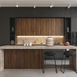 Das dunkle Holz der Oberschränke wurde bei der Insel nochmal aufgegriffen und zwar in gerillter Optik. So bekommt der Raum einen fast grafischen Charakter, eingebettet in die Schränke in Anthrazit. Da macht Kochen Spaß, vor allem mit den stapelbaren Töpfen der Serie „Share & Play“ von MasterPro.